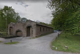 A police cordon is in place at a section of the Whaley Bridge towpath