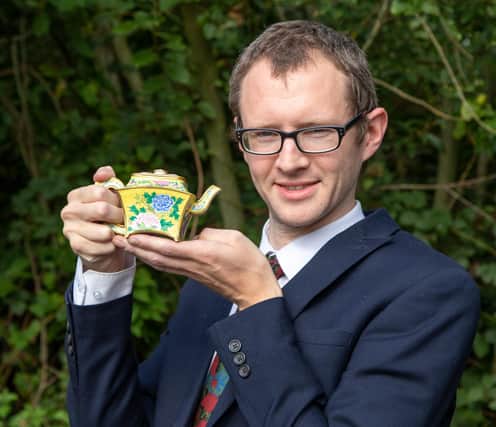 Hansons valuer Edward Rycroft with the imperial Chinese wine ewer.