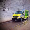 An ambulance in wintery conditions