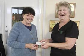 Therapist Sue Hallam presented Cath Finn from the New Mills Youth Matters with £750 to help fund their new sensory room. Photo submitted