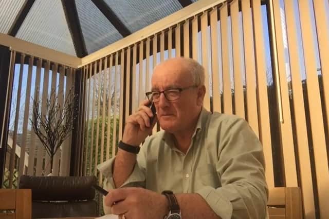 Volunteer John Baker supports people through telephone calls now after a year of lockdowns and social restrictions