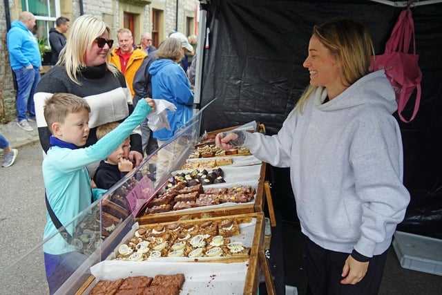 Tideswell food festival. Buying treats from Scrumptious.
