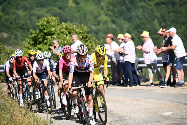 Tour De France Femmes Cyclist Elise Chabbey In The Polka Dot Mountains Jersey Leads The Group. Credit A.S.O & Pauline Ballet. Courtesy Of EMCCA.