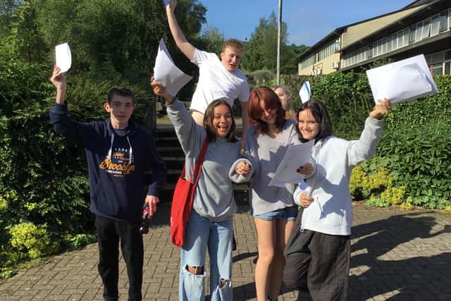 Buxton Community School pupils jumping for joy after reading their GCSE results
