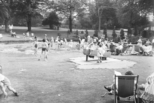 Youngsters playing on the playground in the Gardens.