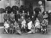 Victor Cavendish, 9th Duke of Devonshire, with his children and grandchildren at Chatsworth, Christmas 1925. Andrew Cavendish, the 11th Duke, sitting at his mother's feet on the far right.  (Photo by NEMPR Picture the Past/Heritage Images/Getty Images)
