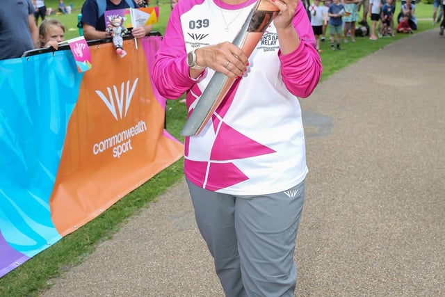 Baton bearer Joanne Lee holds the Queen's Baton during the Birmingham 2022 Queen's Baton Relay visit to Buxton