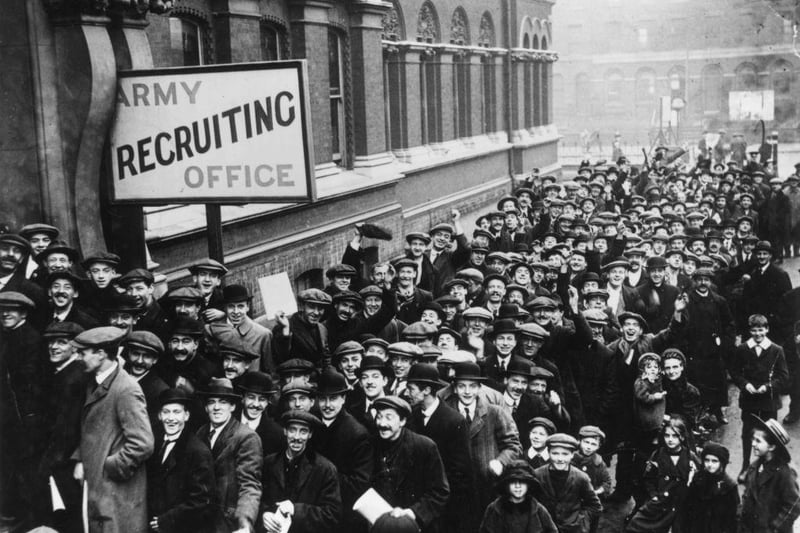 A crowd of young men queuing up at an Army Recruiting Office in December 1915,