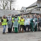 The vaccination team and some of the many volunteers celebrating reaching the 10,000 mark at Buxton's vaccination centre last year. The teams have now been administering the vaccine for a year.