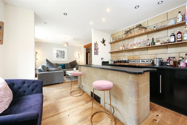 The bar and social sitting room make for great entertaining space within the property.