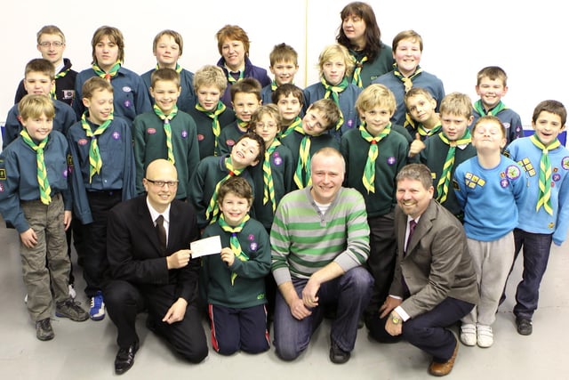 Burbage scouts and cubs celebrate a donation of £500 from the Phoenix Lodge of St Ann. Ex Burbage scout Jonathan Walsh and fellow masons Michael Jones and John Cornwell visited to make the presentation in January 2012. Photo Jason Chadwick