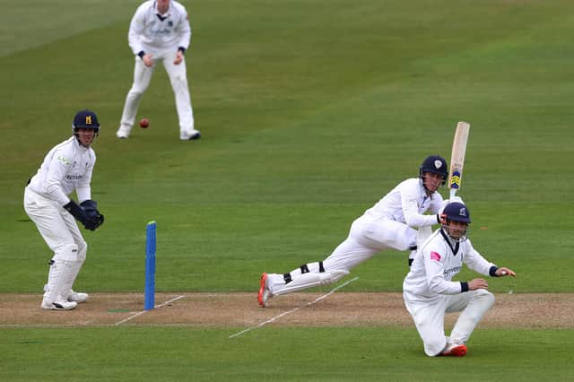 Luis Reece of Derbyshire hits to the legside off the bowling of Danny Briggs of Warwickshire as Sam Hain takes cover at short leg during day one of the Group One LV Insurance County Championship match between Warwickshire and Derbyshire at Edgbaston on April 08, 2021 in Birmingham, England. (Photo by Michael Steele/Getty Images)
