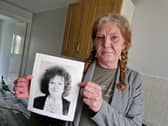 Mandy Shields, from Sheffield, pictured with a photo of sister Dawn, who was murdered in 1994