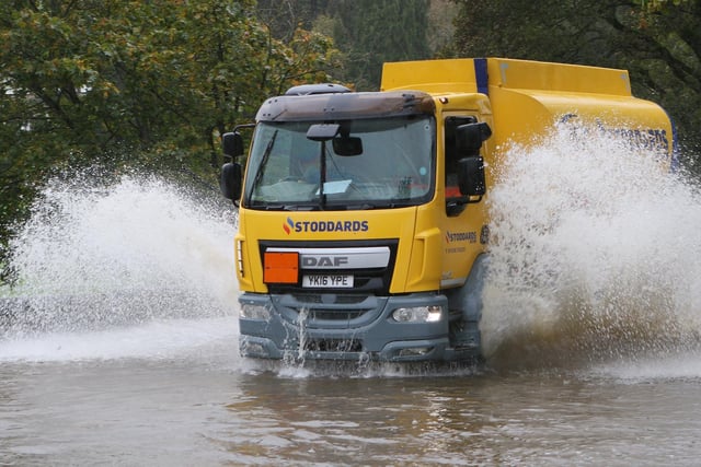 A lorry driving through flood water in Bakewell. Photo Jason Chadwick