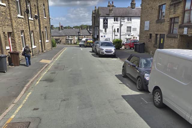Susan was fined for stopping on Bath Road while visiting clients at St Anne's House, right.