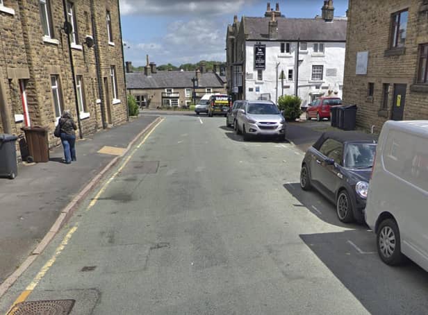 Susan was fined for stopping on Bath Road while visiting clients at St Anne's House, right.