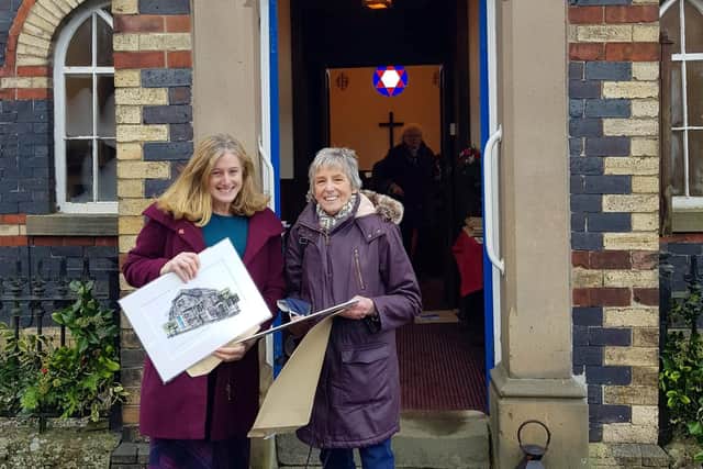 County councillor Ruth George and local resident Audrey Thornhill with the Hidden Histories print by Rebecca Clitheroe.