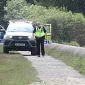 Police on Dam wall at Toddbrook Reservoir