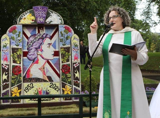 Rev Liz England the Buxton town rector blessing the St Ann's well