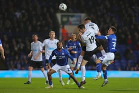 Connor Kirby gets up for a header as Buxton attack at Ipswich. Photo: Matchday Images.