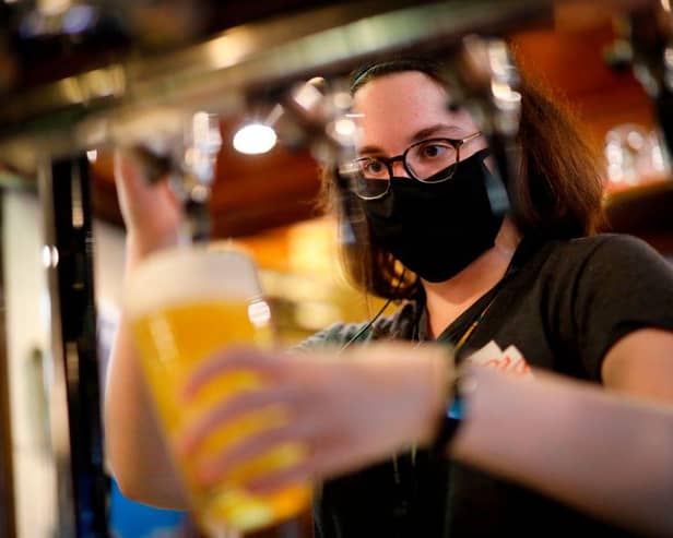 Pubs and restaurants could be allowed to open again for outdoor service only from April (Photo by TOLGA AKMEN/AFP via Getty Images)