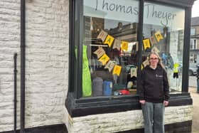 Carly Barnes from the Thomas Theyer shop  outside the London Road premises which is going up for auction next month. Photo Thomas Theyer Foundation