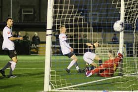 Connor Kirby (in blue) scores for Buxton. All photos by Jason Chadwick.