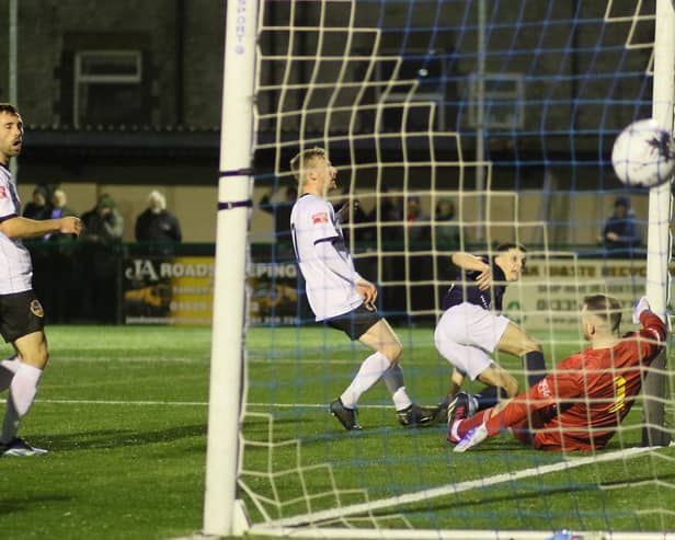 Connor Kirby (in blue) scores for Buxton. All photos by Jason Chadwick.