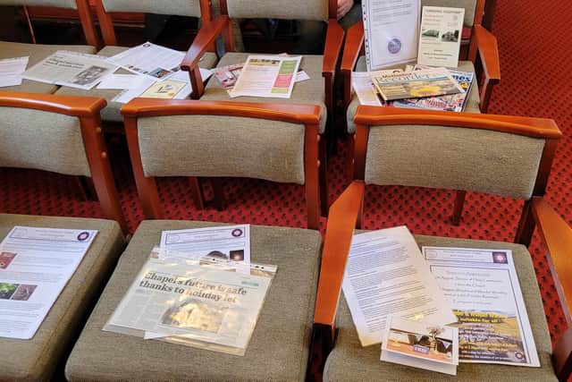 Some of the Buxton Advertiser press cuttings going into the Fernilee Chapel time capsule. Pic submitted.