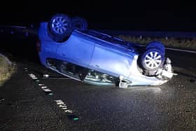 A suspected drink-driver has flipped their car onto its roof on the Woodhead Pass in Derbyshire’s High Peak. Image: Derbyshire police.