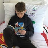 Jack in Y6 at St Anne's CVA Buxton showing off his new reading cushion. Pic submitted