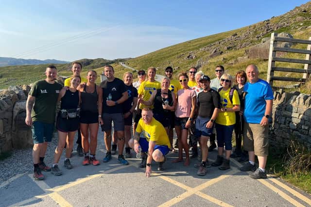 Matt with his family and friends at the finish line in the foothills of Snowdon.