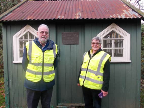 Trevor Gilman and Frances Allen examine Frood’s shed, now in the Ferodo grounds at Chapel-en-le-Frith. Pic submitted