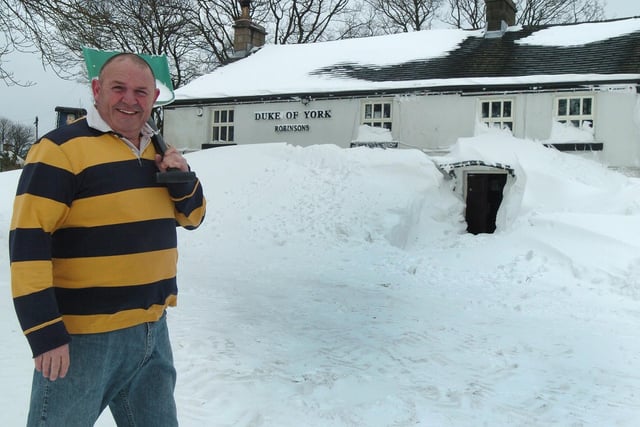 Keith Jackson landlord of the Duke of York at Pomeroy, south of Buxton, digging out after four days without a customer back in 2013