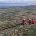 Edale Mountain Rescue Team set up the technical rope rescue system to raise the casualty back to the summit.