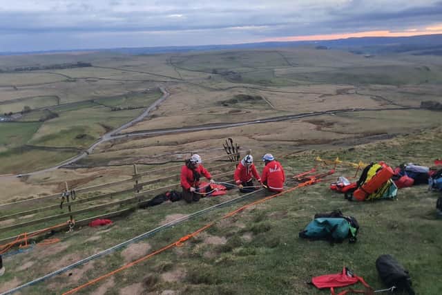 Edale Mountain Rescue Team set up the technical rope rescue system to raise the casualty back to the summit.