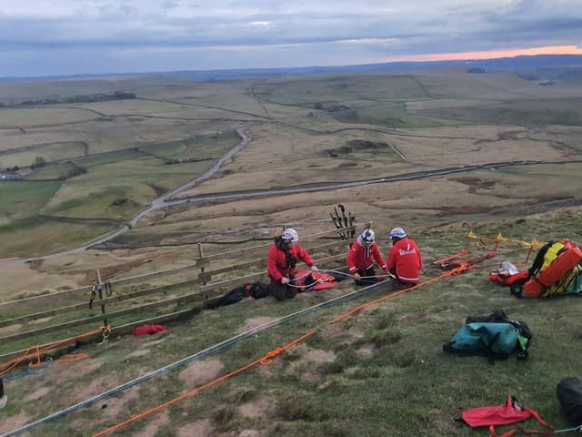 Edale Mountain Rescue Team set up the technical rope rescue system to raise the casualty back to the summit.