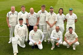 Buxton's second team celebrate a memorable promotion.