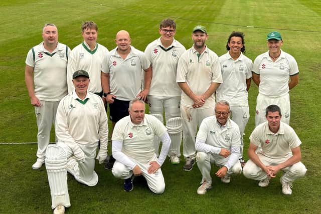 Buxton's second team celebrate a memorable promotion.