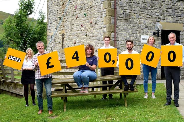 From left, JCB and Lindley staff Harriet Graves, Andy Robinson, Vanessa Hallam, Matthew Pickard, Tristan Mann, Biddy Egan and Neil Fowkes.