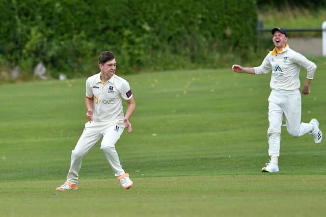 New Mills' Theo Proctor shows delight at taking the wicket of Pott Shrigley's Simon Rajwer. Photo by John Fryer.