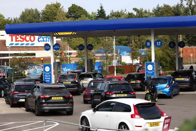 Motorists have rushed to fill up their tanks in recent days despite being told not to panic buy (Photo by ADRIAN DENNIS/AFP via Getty Images)