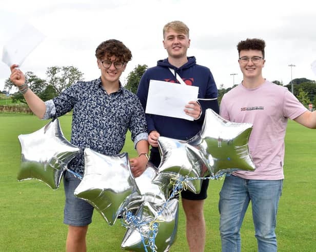 From left, Buxton boys Ben O’Donnell, Xavier Moore and Toby Denton celebrate their A-level results. (Photo: Michael Carter/King's School)