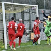 Manu Omorogbe heads home for New Mills. Photo by John Fryer.