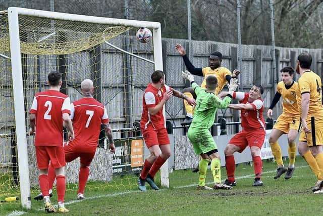 Manu Omorogbe heads home for New Mills. Photo by John Fryer.