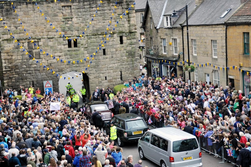 The Queen and Prince Philip get back into their car before heading off through Bondgate Tower, with huge crowds bidding them a fond farewell.