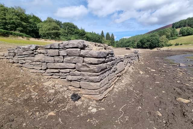 Another of the buildings which has emerged after water levels at Ladybower Reservoir fell dramatically