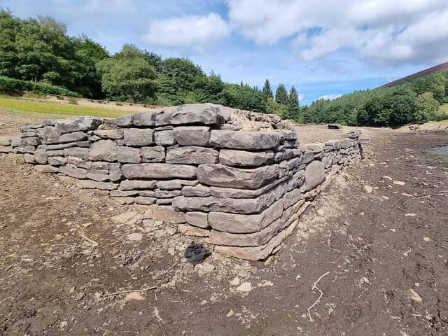 Another of the buildings which has emerged after water levels at Ladybower Reservoir fell dramatically