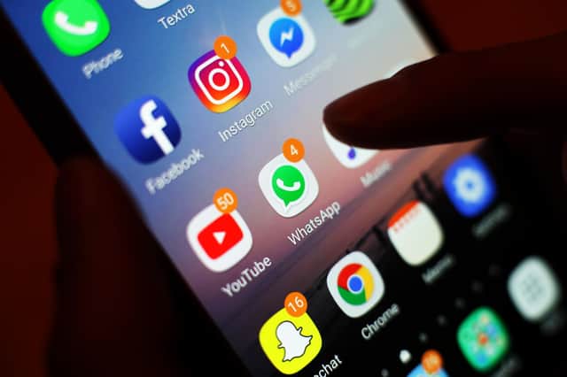 Social media apps displayed on a mobile phone screen. PIC: Yui Mok/PA Wire