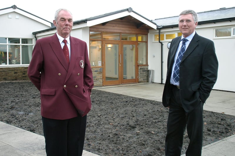 New Mills Golf Club captain Eddie Kelsey and president Ray Farrell in front of the club house extension.